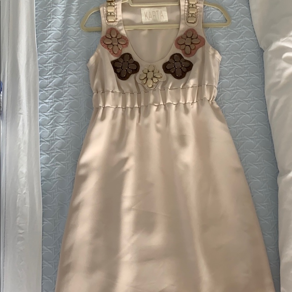 Karta bejeweled light tan dress.